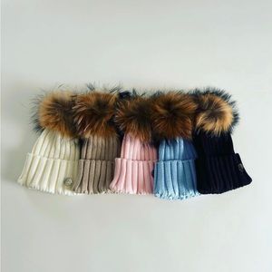 Cotton hat with fur pom pom clip ons